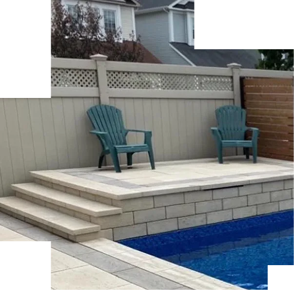 Raised paver seating platform with steps beside a composite privacy fence and cedar gate